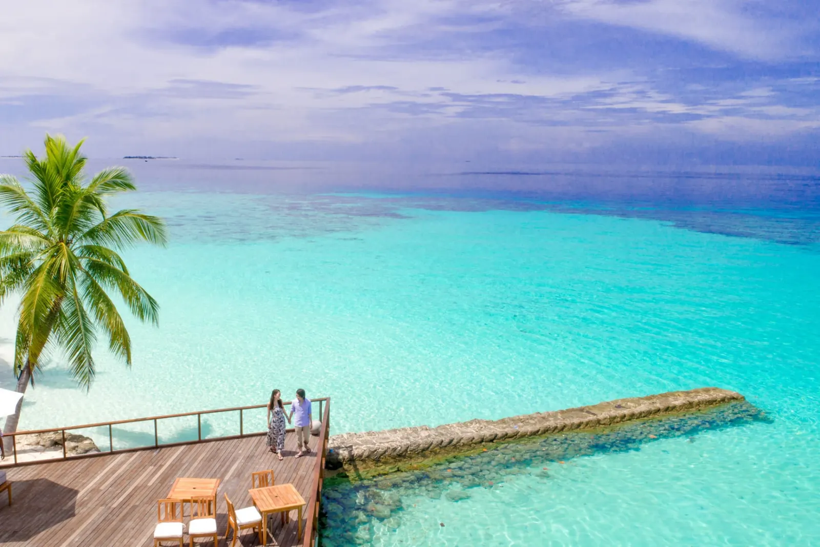 Turquoise lagoon and wooden jetty at a beach resort